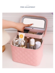 Detail of pink quilted LED makeup bag with touchscreen mirror and storage trays