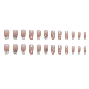 French tip ballet press-on nails with metal cross, pearls, and white marble patterns