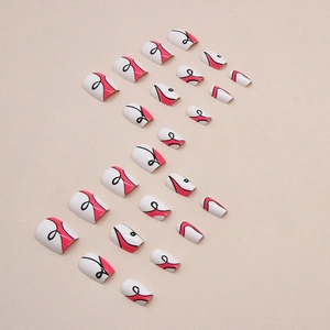 Short ballet nails with pink and black abstract wave patterns on white base