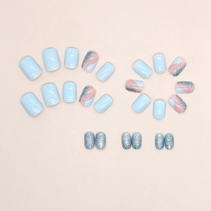 Short sky blue press-on nails set with glitter and wavy patterns for summer styling