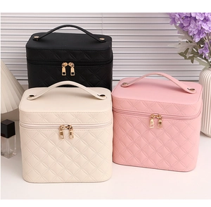 Quilted PU leather makeup bags in black, beige, and pink colors with sturdy top handles
