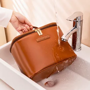 Waterproof brown PU leather makeup bag with dual zippers and large storage capacity