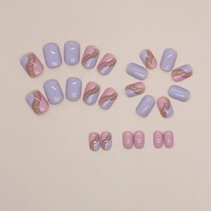 Pink and purple wavy short press-on nails with white dots in a 24-piece full set