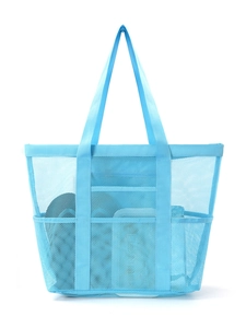 Detail view of large sky blue mesh beach bag with three front pockets and wide straps