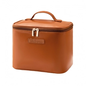 Caramel brown PU leather makeup bag with gold zippers and top handle on white background