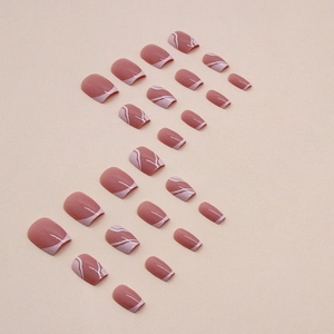 Pink short ballerina press-on nails with minimalist white wave patterns in various sizes