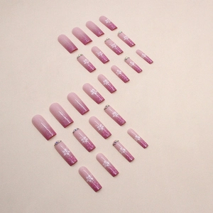 Pink gradient glitter press-on nails with white tropical flowers and rhinestone accents