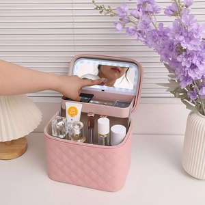 Pink quilted leather makeup case with integrated LED mirror and double-layer storage