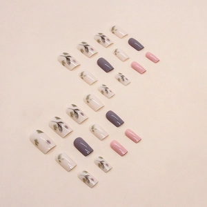 Pink and purple press-on nails set with watercolor leaf art in a minimalist style