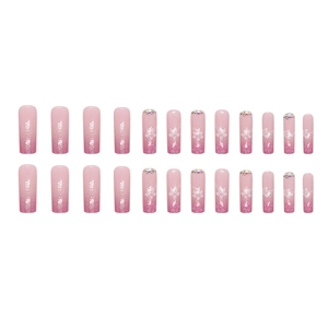 Pink gradient floral press-on nails with glitter, rhinestones and tropical patterns