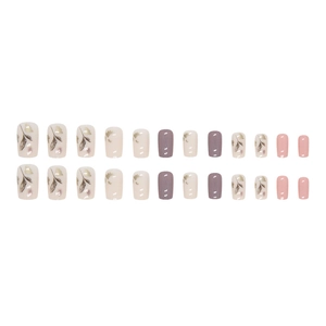 Pink and purple press-on nails with botanical leaf prints and matte square-oval finish