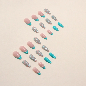 Almond press-on nails with green French tips, floral patterns, and blue abstract lines