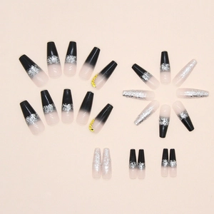 Black gradient coffin press-on nails with silver glitter and sparkling yellow rhinestones