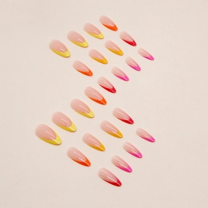 Rainbow almond press-on nails with colorful French tips in yellow, orange, and pink