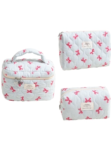 Set di pochette per trucco trapuntate a scacchi blu con fiocchi rosa e zip