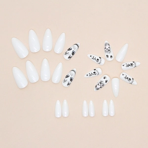 Almond-shaped glossy white press-on nails with cute cat portraits and black paw prints