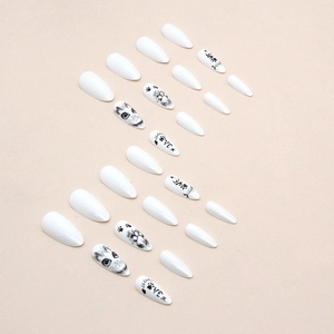 Aurora almond stiletto press-on nails with white cat-eye and paw print painted designs