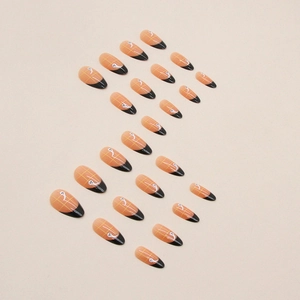 Halloween almond fake nails with orange plaid design and black French tips with ghost patterns
