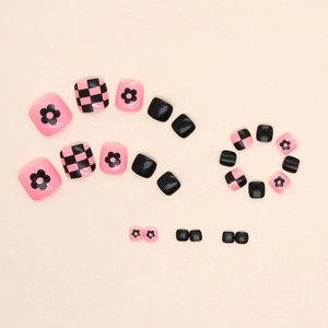 Pink and black checkerboard press-on toenails with floral patterns for pedicure