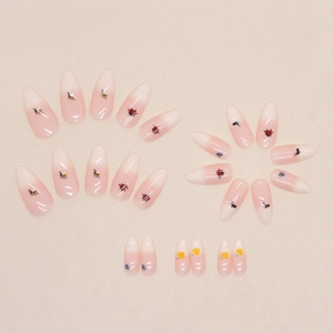 Cute insect-themed almond press-on nails with apricot gradient and tiny garden bug motifs