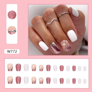 Short square press-on nails set with pink glitter, star patterns and leopard prints