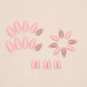 Matte pink almond press-on nails featuring gold foil flakes and silver wavy French lines