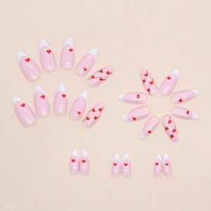 Pink almond press-on nails with white French tips and red heart patterns for Valentine's