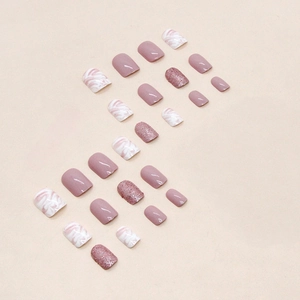 Short square pink and white press-on nails with marble ink and glitter design