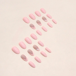 Matte pink almond press-on nails with gold foil flakes and V-shaped French design