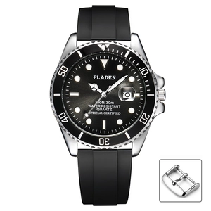 Classic silver quartz diving watch with black silicone strap and luminous green dial