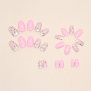Short oval fake nails with pink floral patterns and silver glitter in a stylish set