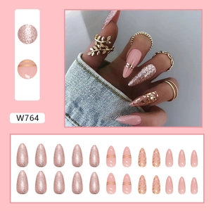 Pink leopard almond press-on nails with glitter accents and gold stripe details