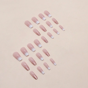 Faux ongles dégradés blanc et rose avec paillettes de style ballerine française