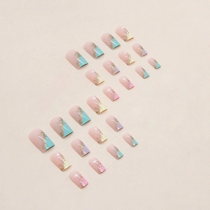 Rainbow gradient press-on nails with gold foil and marble pattern in medium square shape