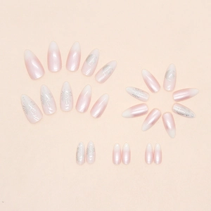 Pink and purple gradient press-on nails with silver star and moon patterns, almond shape
