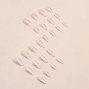 Pink and white gradient almond press-on nails with silver celestial star designs