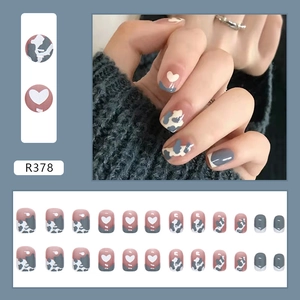 Short square press-on nails set featuring blue-grey heart and cow print designs