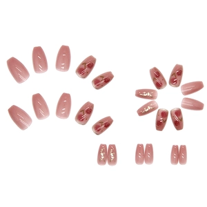 Pink translucent press-on nails with red floral patterns and gold foil flakes