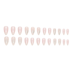 Almond shaped press-on nails with celestial moon and star pattern in gradient aurora pink