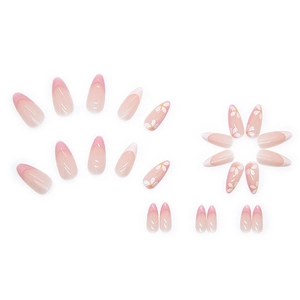 Faux ongles amande rose français avec motifs marguerites et dégradé brillant élégant