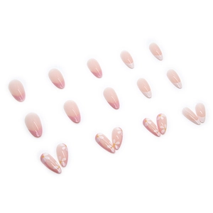 Faux ongles amande avec pointes French roses et motifs floraux de marguerites