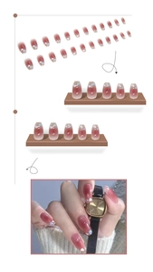 Detailed view of ballet style gradient pink heart press-on nails in various sizes