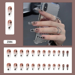 Star pattern coffin press-on nails with rhinestones and black heart designs