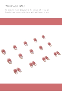 Detail showing heart pattern gradient press-on nails in pink and ballet style