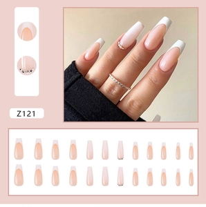 Detail of long ballerina press on nails with French white tips and rhinestone accents