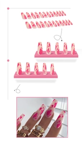 Detailed view of pink cow print long ballet press-on nails with real wearing effect
