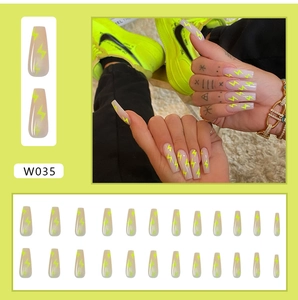 Detailed view of 24pcs long coffin press on nails with neon green lightning bolt designs