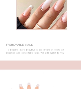 Detailed view of long almond press on nails with classic French tips and small rhinestones