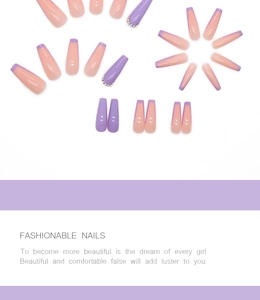 Detail of long coffin press on nails in purple and nude pink with rhinestones