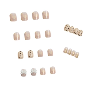 Short square press-on nails with 3D bow accents and pink glitter patterns